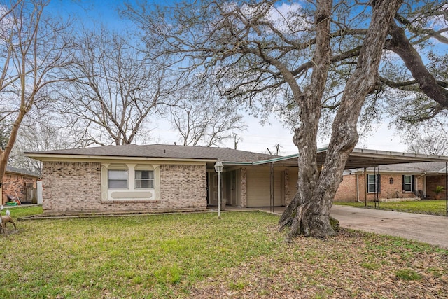 single story home with a carport and a front lawn