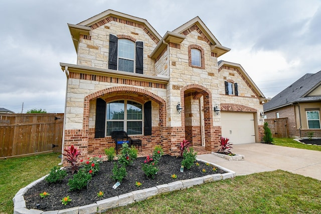 view of front of property with a garage, concrete driveway, stone siding, fence, and brick siding