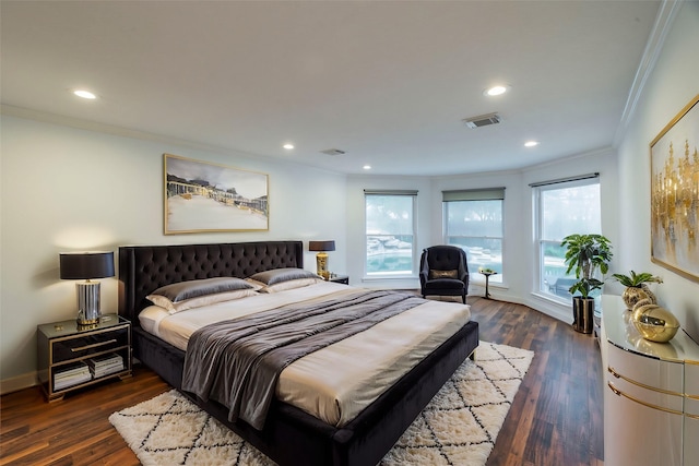 bedroom featuring dark wood-style floors, recessed lighting, visible vents, and crown molding