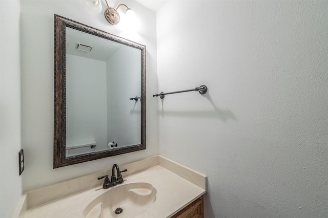 bathroom with visible vents and vanity