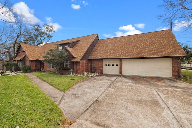 view of front of property with a garage and a front lawn