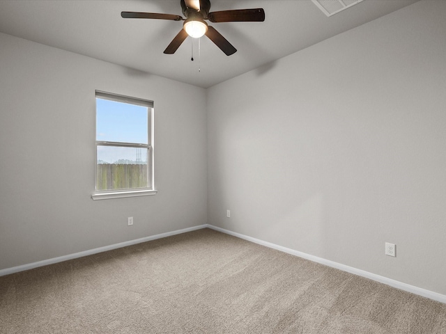 spare room featuring ceiling fan and carpet flooring