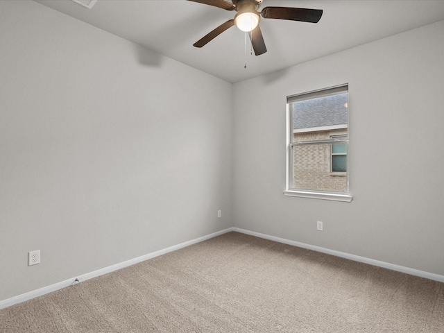 spare room with ceiling fan and carpet floors