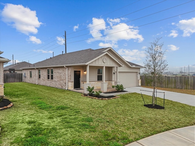 ranch-style house with a front yard, fence, driveway, a garage, and board and batten siding