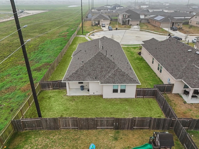 birds eye view of property with a residential view