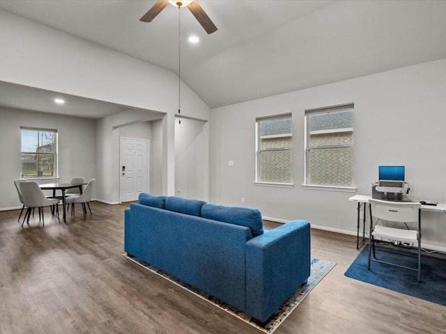 living room featuring vaulted ceiling, hardwood / wood-style floors, and ceiling fan