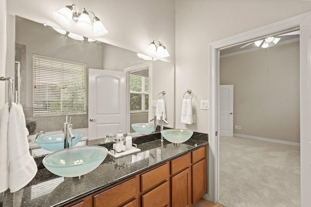 bathroom with vanity, ceiling fan, and crown molding