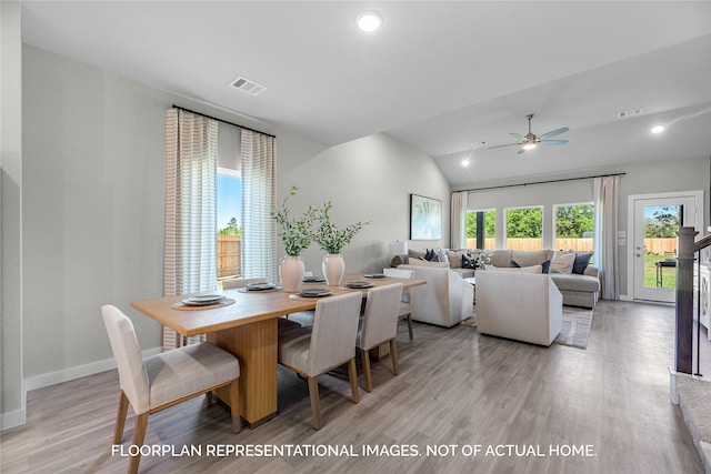 dining area featuring lofted ceiling, light hardwood / wood-style floors, and ceiling fan