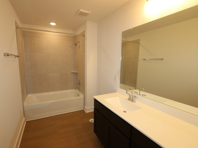 134 Spring Rose Dr, Magnolia, TX 77354 - bathroom featuring vanity, wood finished floors, tub / shower combination, and recessed lighting