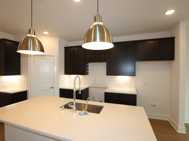 134 Spring Rose Dr, Magnolia, TX 77354 - kitchen with a sink, dark wood-type flooring, tasteful backsplash, recessed lighting, and baseboards