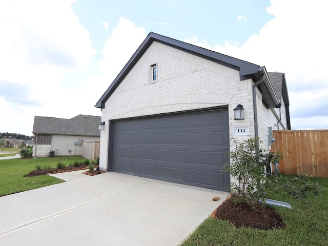 134 Spring Rose Dr, Magnolia, TX 77354 - view of side of home featuring driveway and brick siding