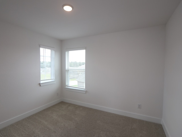 134 Spring Rose Dr, Magnolia, TX 77354 - unfurnished room featuring light carpet and baseboards