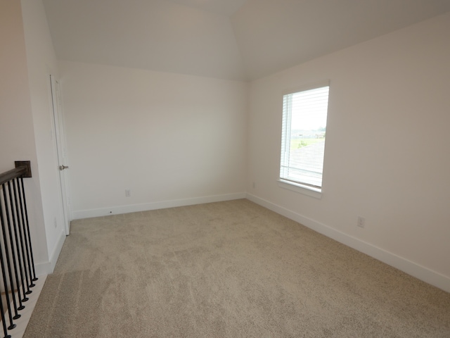 134 Spring Rose Dr, Magnolia, TX 77354 - unfurnished room featuring light carpet and lofted ceiling