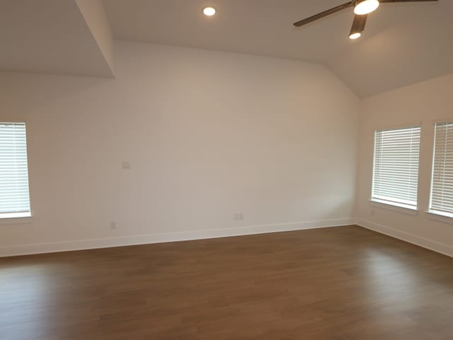 134 Spring Rose Dr, Magnolia, TX 77354 - unfurnished room featuring ceiling fan, dark wood-type flooring, vaulted ceiling, and recessed lighting