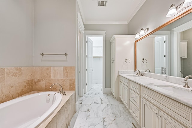 bathroom featuring vanity, tiled tub, and ornamental molding