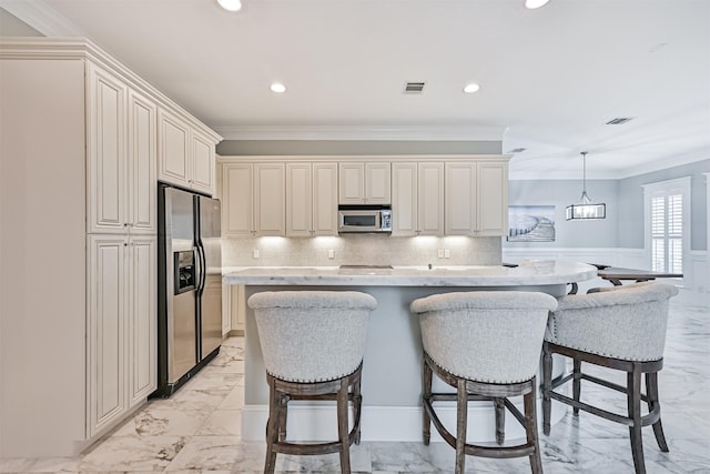 kitchen with pendant lighting, decorative backsplash, a center island, stainless steel appliances, and crown molding