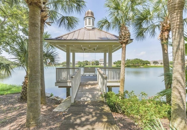 dock area with a gazebo and a water view