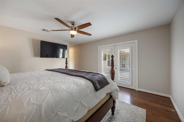 bedroom featuring dark hardwood / wood-style flooring, access to outside, and ceiling fan