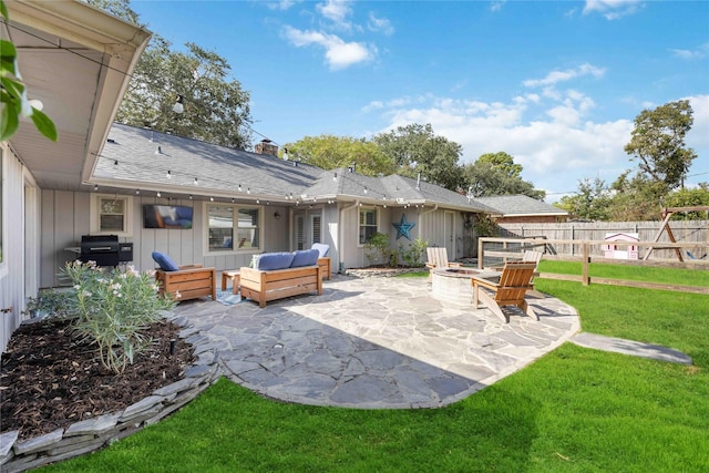 view of patio featuring a grill and an outdoor living space with a fire pit