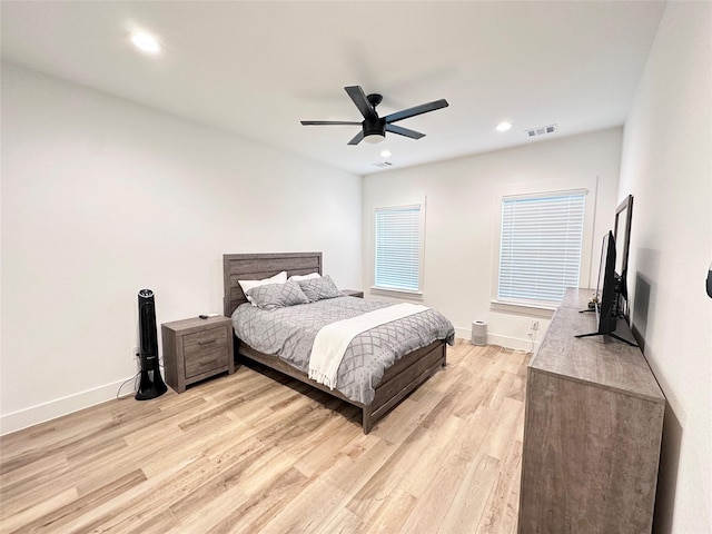 bedroom featuring light hardwood / wood-style floors and ceiling fan