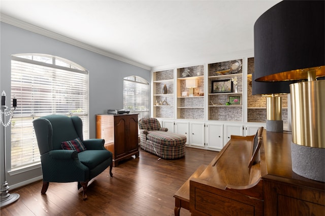 living area featuring crown molding, dark hardwood / wood-style flooring, and built in features