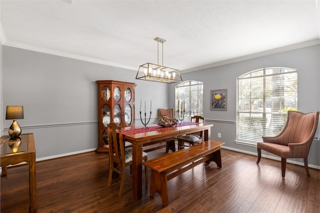 dining room with dark hardwood / wood-style flooring and ornamental molding