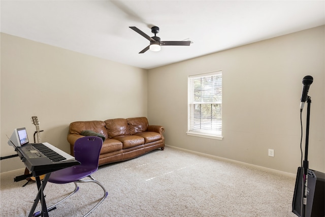 carpeted living room featuring ceiling fan