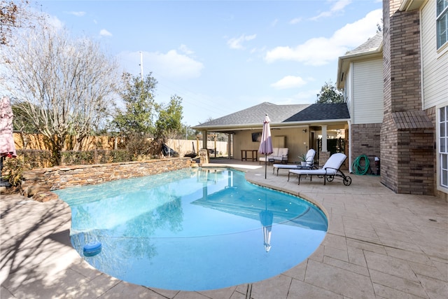 view of swimming pool with a patio area