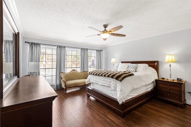 bedroom featuring dark hardwood / wood-style flooring, crown molding, a textured ceiling, and ceiling fan