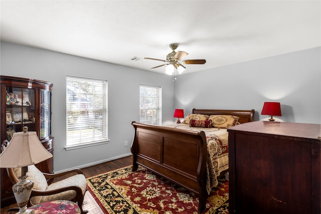 bedroom featuring dark wood-type flooring and ceiling fan