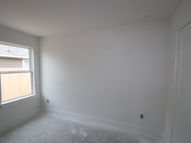 740 Autumn Cherry Trl, Magnolia, TX 77354 - spare room with baseboards, a smoke detector, and concrete floors