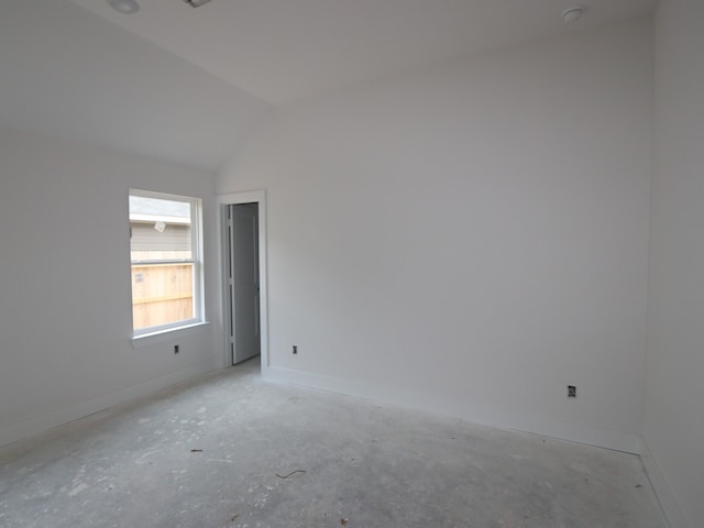 740 Autumn Cherry Trl, Magnolia, TX 77354 - unfurnished room with baseboards, lofted ceiling, and concrete floors