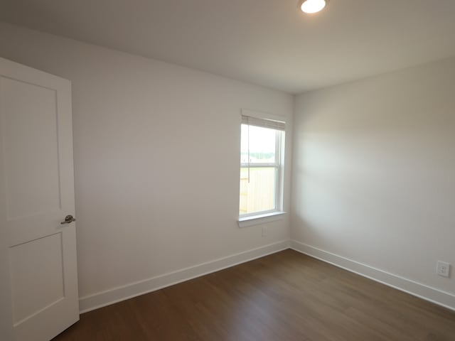 740 Autumn Cherry Trl, Magnolia, TX 77354 - unfurnished room with dark wood finished floors and baseboards