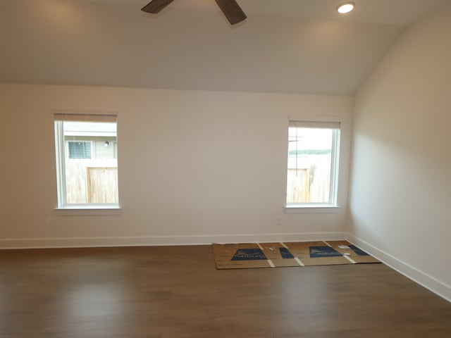 740 Autumn Cherry Trl, Magnolia, TX 77354 - spare room with vaulted ceiling, dark wood-style flooring, baseboards, ceiling fan, and recessed lighting