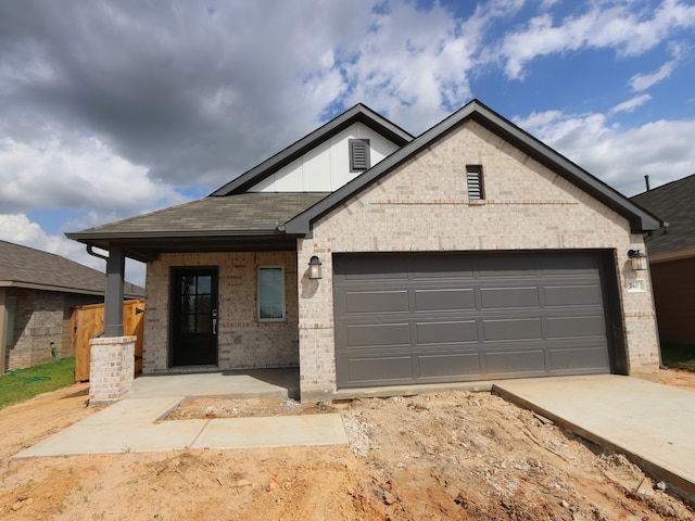 740 Autumn Cherry Trl, Magnolia, TX 77354 - view of front of home with brick siding, a garage, and concrete driveway