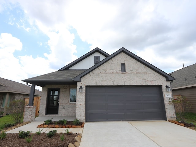 740 Autumn Cherry Trl, Magnolia, TX 77354 - view of front of home with driveway, brick siding, an attached garage, and a porch