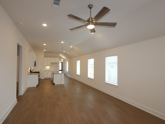 740 Autumn Cherry Trl, Magnolia, TX 77354 - unfurnished living room featuring recessed lighting, dark wood-style flooring, and a ceiling fan