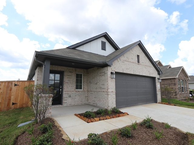 740 Autumn Cherry Trl, Magnolia, TX 77354 - view of front of house with brick siding, a garage, board and batten siding, and concrete driveway
