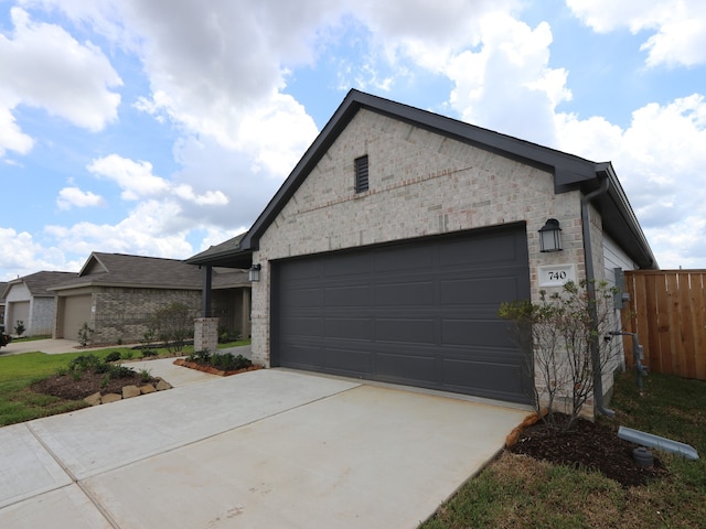 740 Autumn Cherry Trl, Magnolia, TX 77354 - single story home with concrete driveway, a garage, stone siding, and brick siding