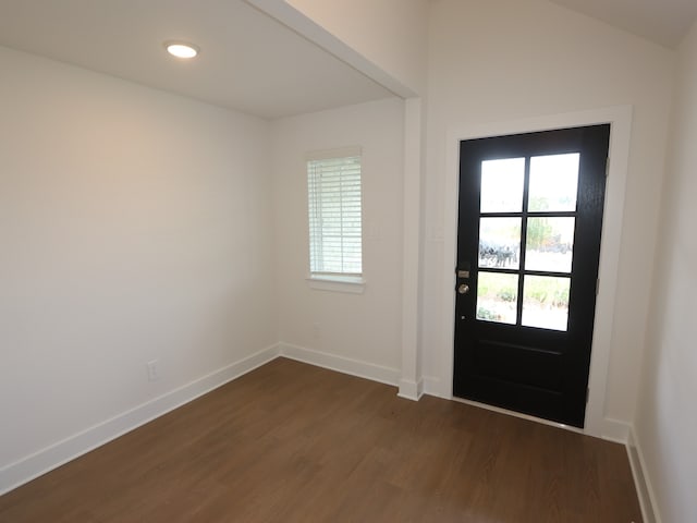 740 Autumn Cherry Trl, Magnolia, TX 77354 - foyer with dark wood-style floors and baseboards