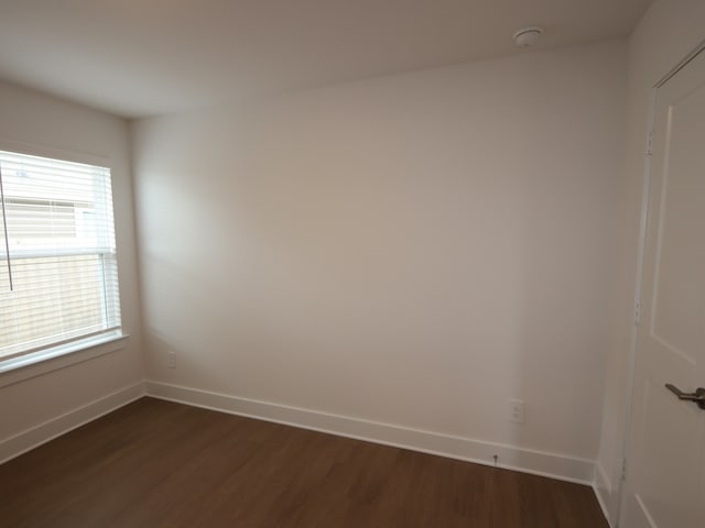 740 Autumn Cherry Trl, Magnolia, TX 77354 - empty room featuring dark wood finished floors and a smoke detector