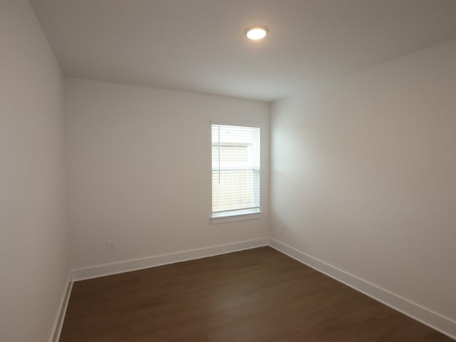 740 Autumn Cherry Trl, Magnolia, TX 77354 - unfurnished room featuring dark wood-type flooring and baseboards