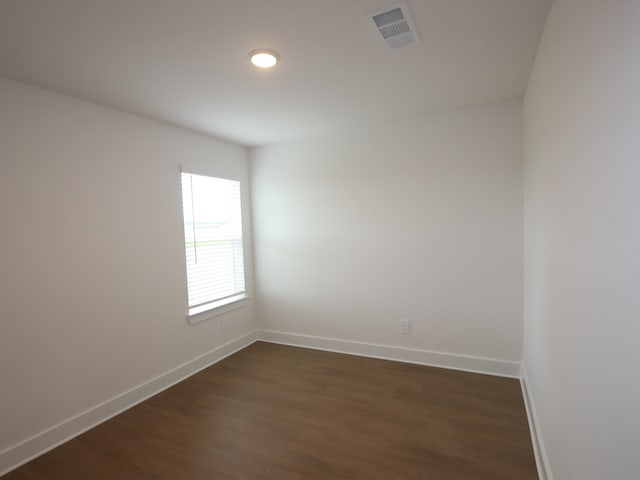 740 Autumn Cherry Trl, Magnolia, TX 77354 - empty room featuring dark wood-style floors and baseboards