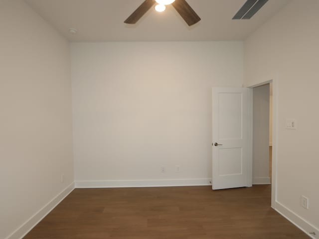 740 Autumn Cherry Trl, Magnolia, TX 77354 - spare room featuring a ceiling fan and dark wood-style flooring
