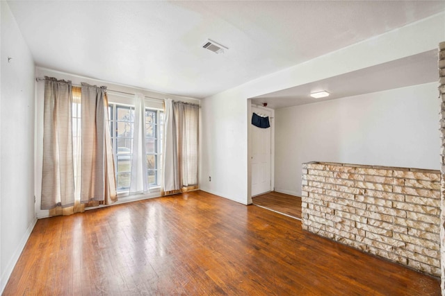 spare room featuring hardwood / wood-style flooring