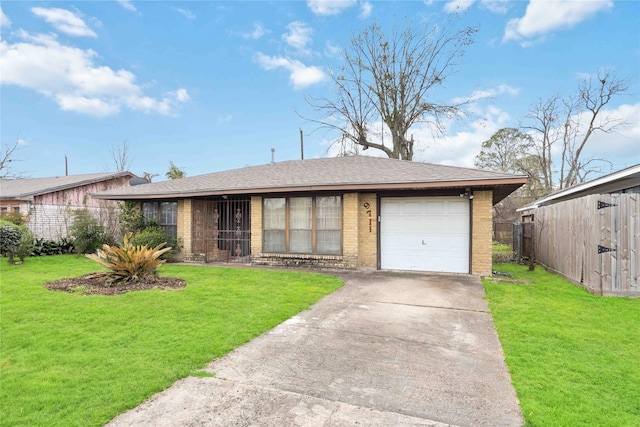 single story home featuring a garage and a front lawn