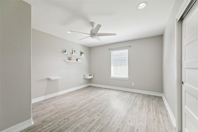 interior space with ceiling fan, a closet, and light wood-type flooring