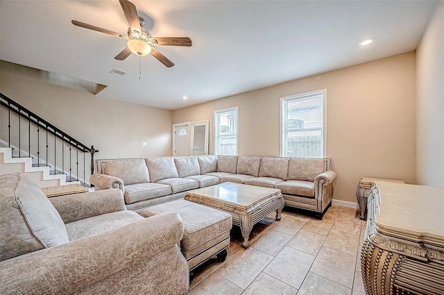 tiled living room featuring ceiling fan