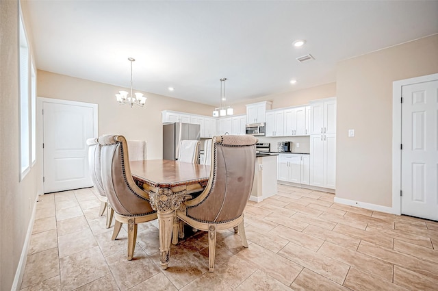 dining room with a chandelier