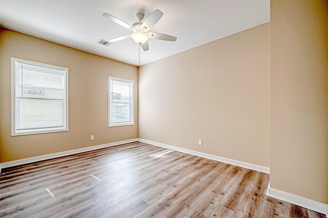 unfurnished room featuring ceiling fan and light wood-type flooring